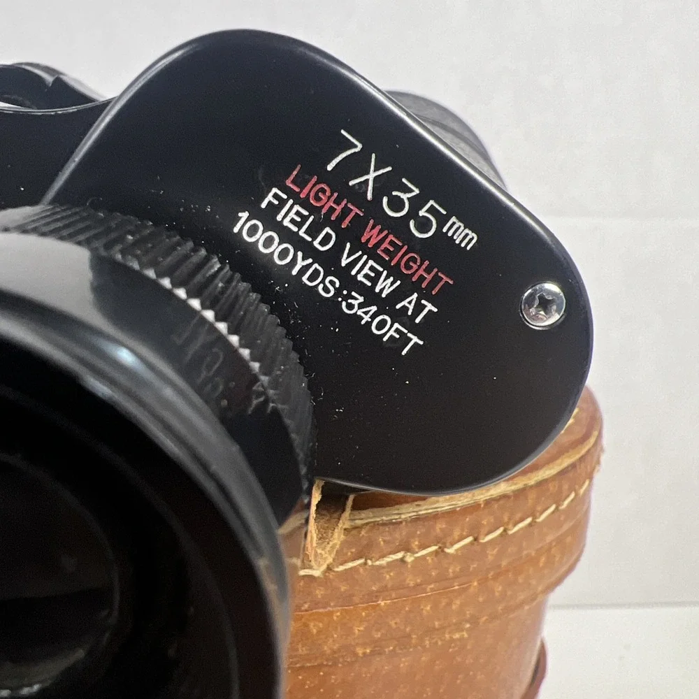 Vintage 50s-60s Tasco binoculars featuring 